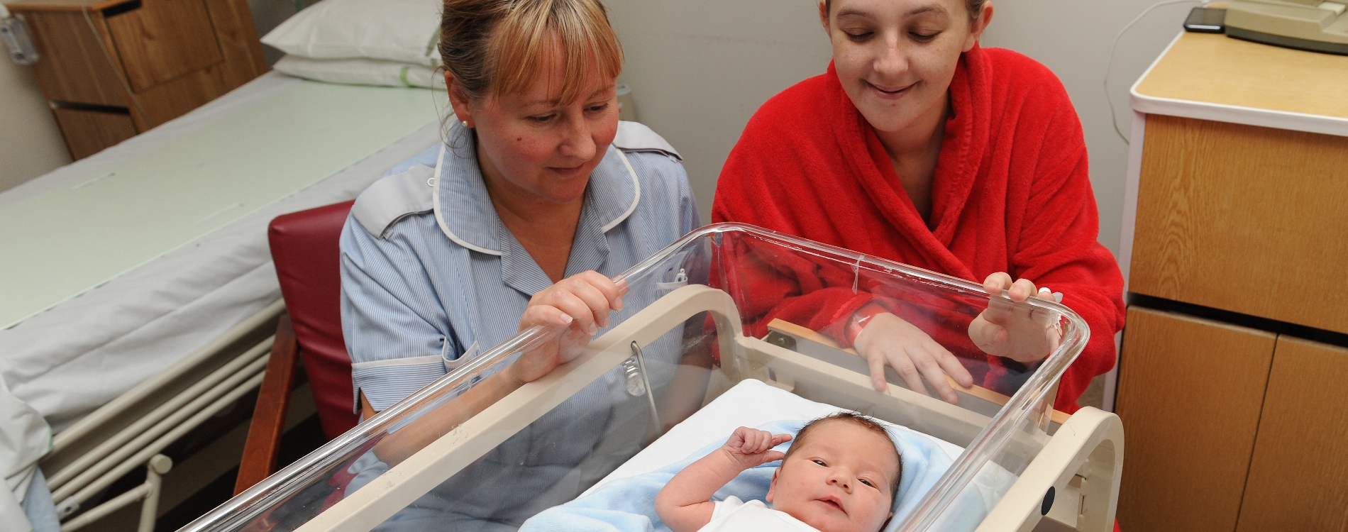 Mum, baby and staff member
