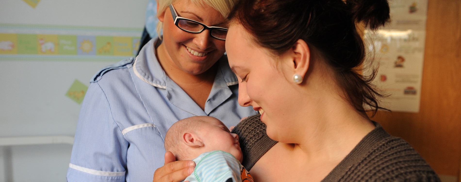 Mum, baby and staff member