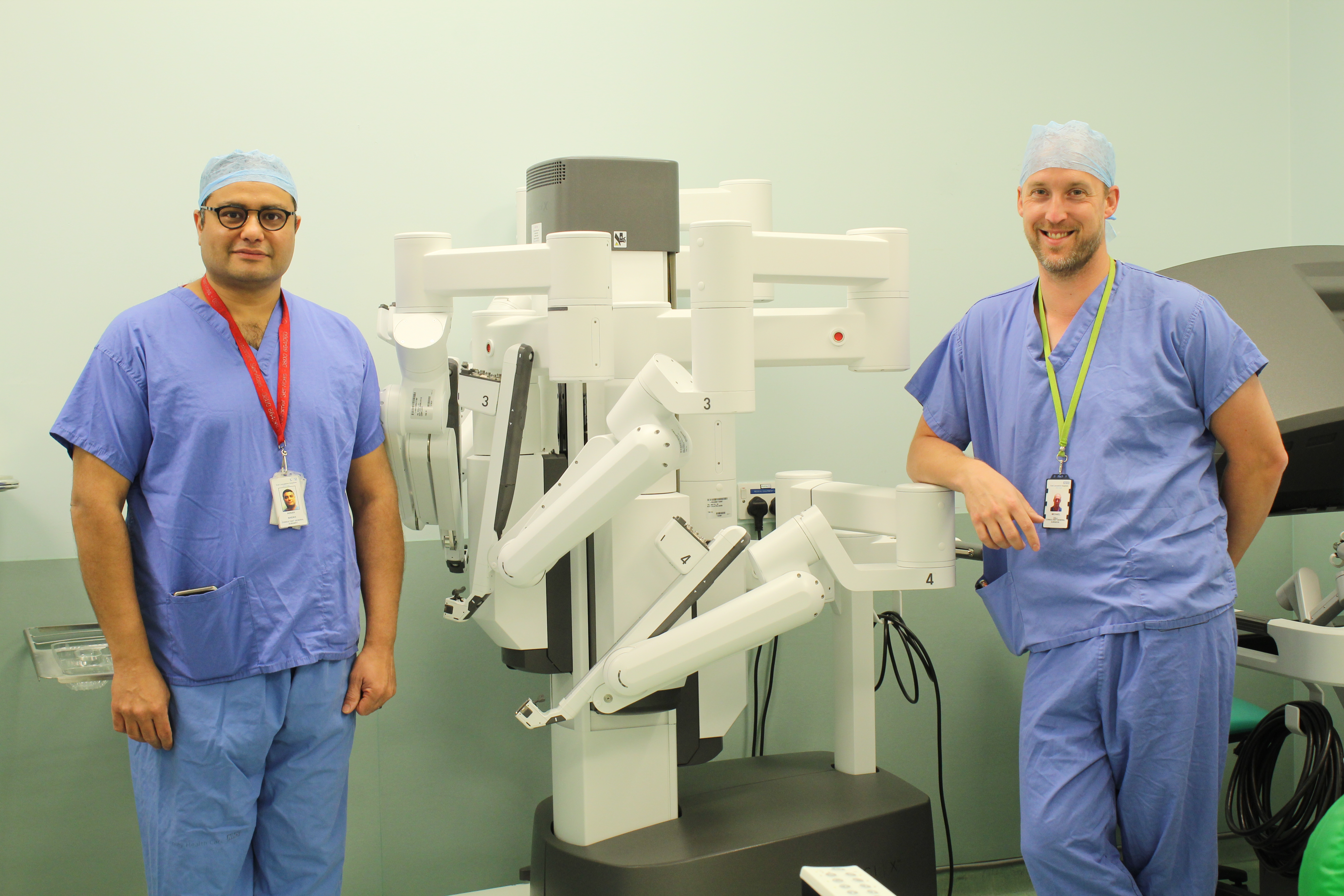 Mr Adnan Sheikh and Mr Micheal Gill with the surgical robot