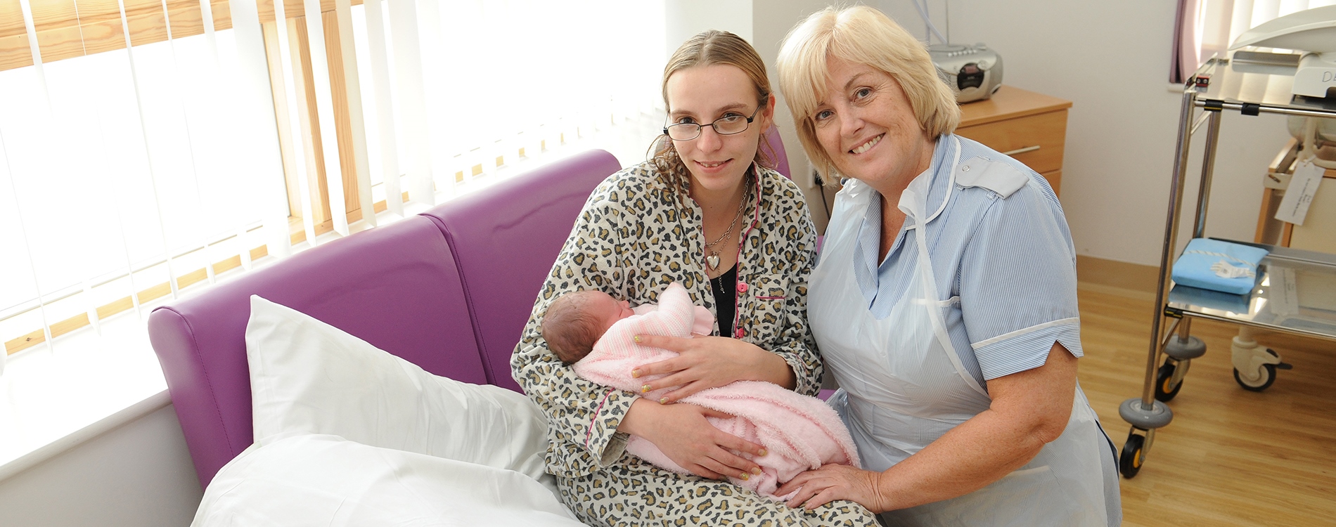 Mum, baby and staff member