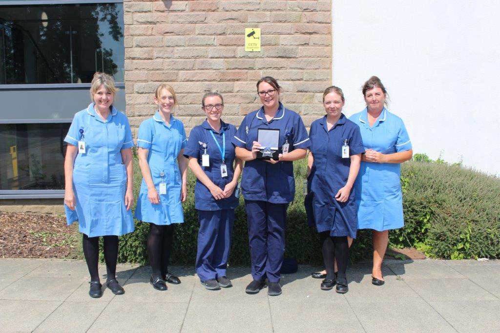 Hyndburn District Nurses with their award