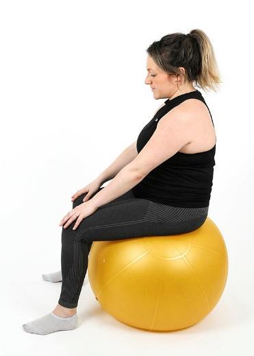 Showing pelvic tilt sitting exercise