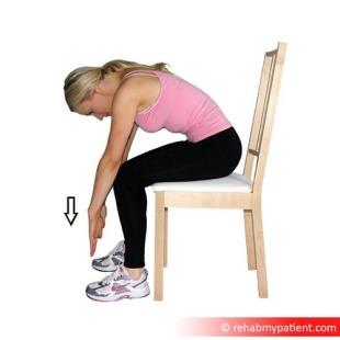 Showing seated lumbar flexion exercise